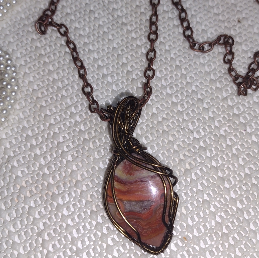 Copper wire wrapped pendant.